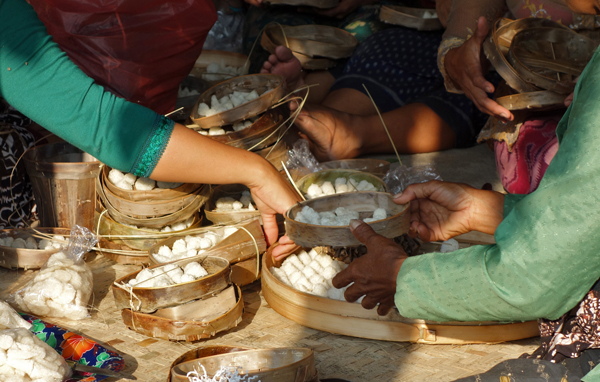 Women making offerings